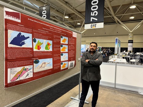 M.Sc. student Berkay Ersus standing in front of his poster at the 2025 PDAC-SEG colloquium